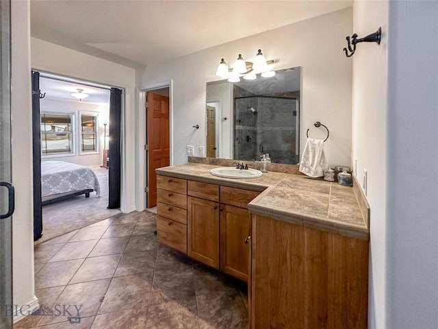 4442 Alexander, Bozeman, MT 59718 - full bathroom with a stall shower, vanity, ensuite bathroom, and tile patterned flooring