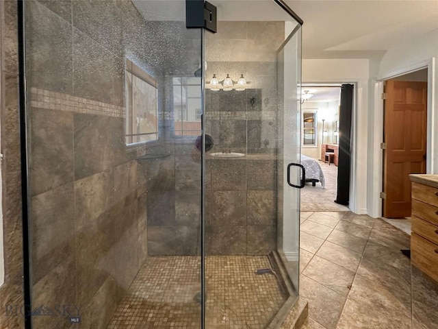 4442 Alexander, Bozeman, MT 59718 - ensuite bathroom with a stall shower, vanity, and tile patterned floors