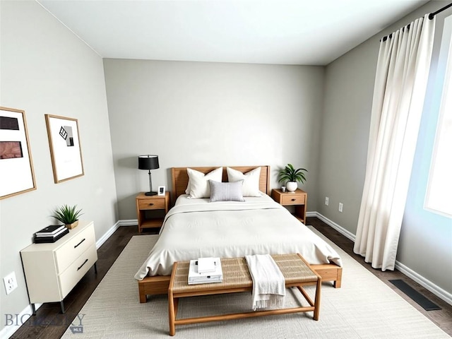 4442 Alexander, Bozeman, MT 59718 - bedroom featuring dark wood-style flooring and baseboards