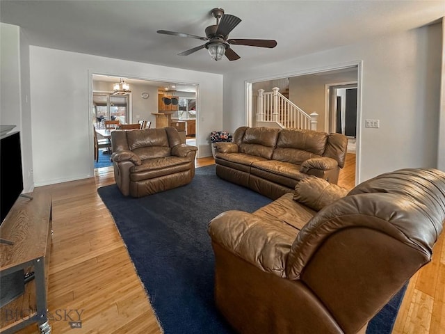 4442 Alexander, Bozeman, MT 59718 - living room featuring stairway, a ceiling fan, light wood finished floors, and baseboards