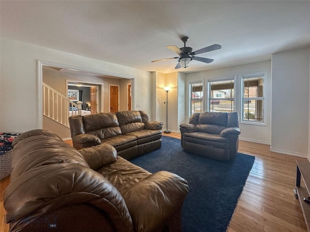 4442 Alexander, Bozeman, MT 59718 - living room with stairs, wood finished floors, a ceiling fan, and baseboards