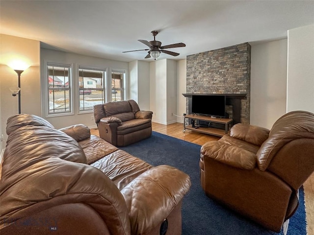 4442 Alexander, Bozeman, MT 59718 - living area with a ceiling fan, a fireplace, wood finished floors, and baseboards