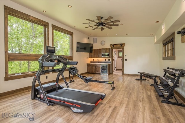 5933 Monforton School Rd, Bozeman, MT 59718 - exercise room with wine cooler, light wood-type flooring, baseboards, and recessed lighting