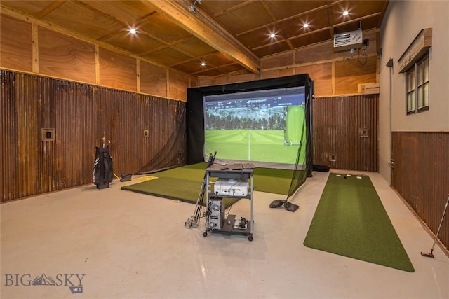 5933 Monforton School Rd, Bozeman, MT 59718 - game room with golf simulator, wooden walls, concrete floors, and a heating unit