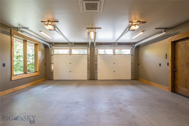 5933 Monforton School Rd, Bozeman, MT 59718 - garage with a garage door opener and baseboards