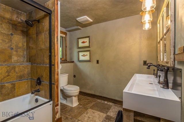 5933 Monforton School Rd, Bozeman, MT 59718 - bathroom featuring toilet,  shower combination, vanity, and baseboards
