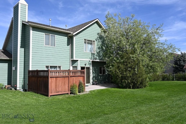 126 Pathfinder Trl, Bozeman, MT 59718 - back of house with a yard and a chimney