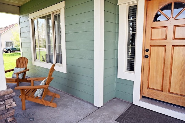 126 Pathfinder Trl, Bozeman, MT 59718 - doorway to property featuring a porch
