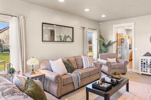 126 Pathfinder Trl, Bozeman, MT 59718 - living room featuring recessed lighting, light colored carpet, and plenty of natural light