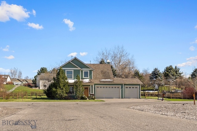 126 Pathfinder Trl, Bozeman, MT 59718 - view of front of home with a garage, driveway, and a chimney