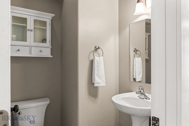 126 Pathfinder Trl, Bozeman, MT 59718 - half bathroom featuring toilet and a sink