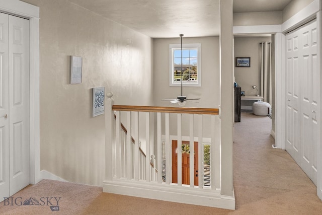 126 Pathfinder Trl, Bozeman, MT 59718 - hallway with carpet flooring and an upstairs landing
