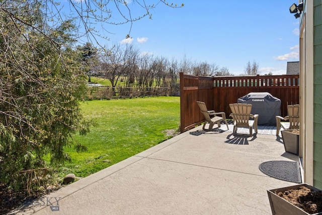 126 Pathfinder Trl, Bozeman, MT 59718 - fenced backyard with a patio area and area for grilling