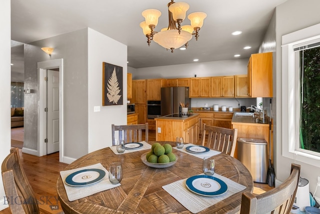 126 Pathfinder Trl, Bozeman, MT 59718 - dining space with a chandelier, light wood-style floors, recessed lighting, and plenty of natural light