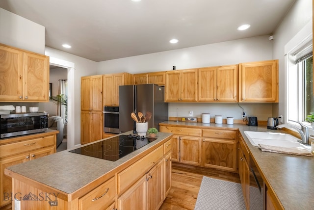 126 Pathfinder Trl, Bozeman, MT 59718 - kitchen with appliances with stainless steel finishes, light wood-type flooring, a center island, and recessed lighting