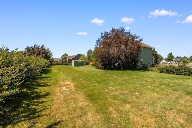 126 Pathfinder Trl, Bozeman, MT 59718 - view of green lawn featuring a shed