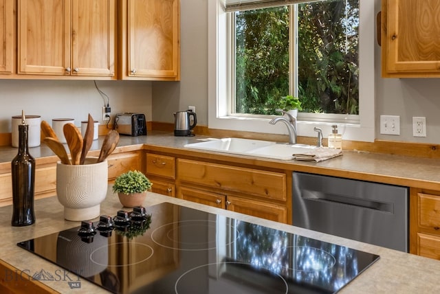 126 Pathfinder Trl, Bozeman, MT 59718 - kitchen featuring stainless steel dishwasher, light countertops, and black electric stovetop