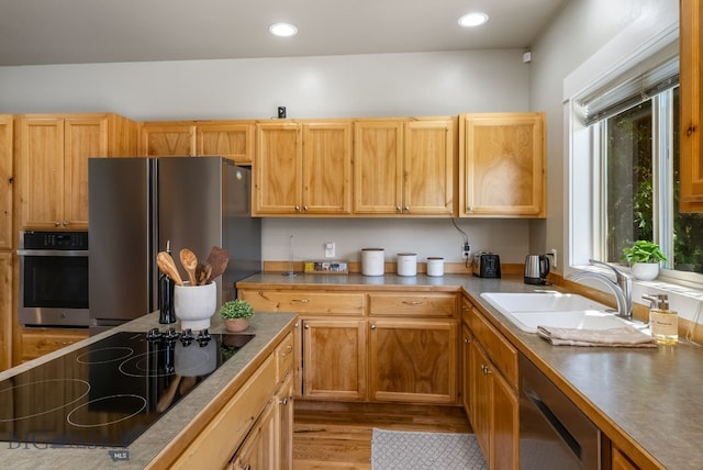 126 Pathfinder Trl, Bozeman, MT 59718 - kitchen featuring appliances with stainless steel finishes, light wood finished floors, and recessed lighting