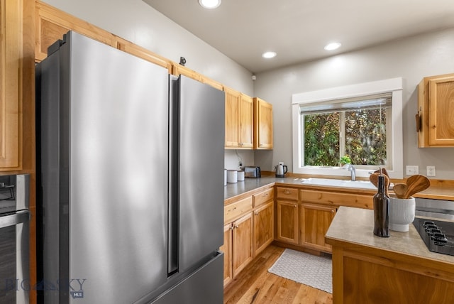 126 Pathfinder Trl, Bozeman, MT 59718 - kitchen featuring freestanding refrigerator, light wood-type flooring, recessed lighting, and light countertops