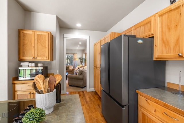 126 Pathfinder Trl, Bozeman, MT 59718 - kitchen with appliances with stainless steel finishes, light wood-style floors, dark countertops, and recessed lighting