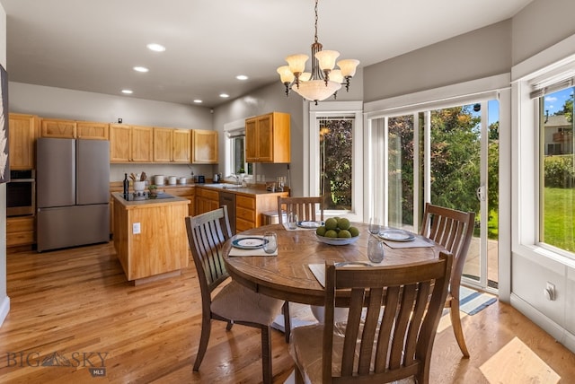 126 Pathfinder Trl, Bozeman, MT 59718 - dining area with healthy amount of natural light, light wood-type flooring, a chandelier, and recessed lighting