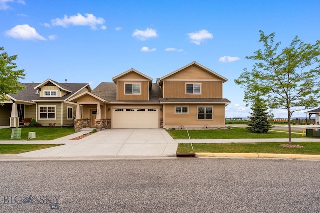 1025 Advance Dr, Bozeman, MT 59718 - view of front of house with an attached garage, driveway, and a front yard