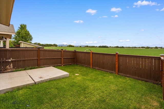 1025 Advance Dr, Bozeman, MT 59718 - fenced backyard with a patio area