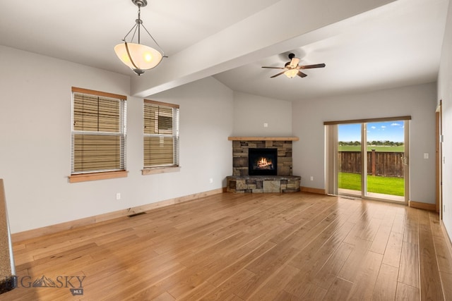 1025 Advance Dr, Bozeman, MT 59718 - unfurnished living room with wood finished floors, a fireplace, and a ceiling fan