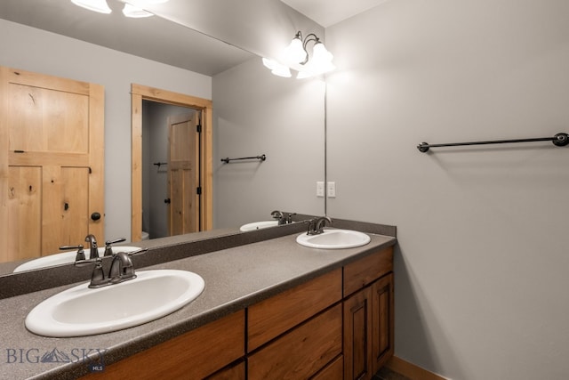 1025 Advance Dr, Bozeman, MT 59718 - bathroom with double vanity and toilet