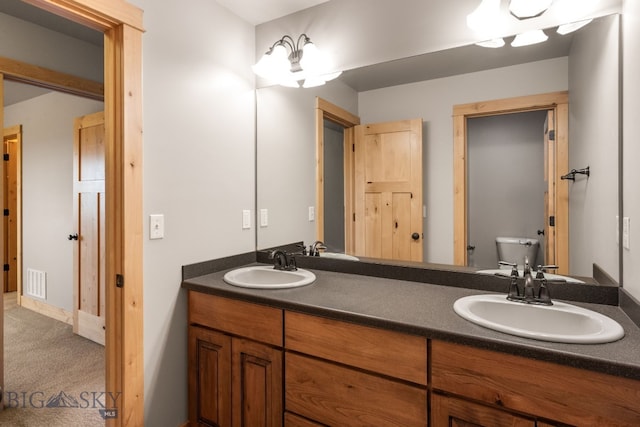 1025 Advance Dr, Bozeman, MT 59718 - bathroom featuring double vanity and toilet