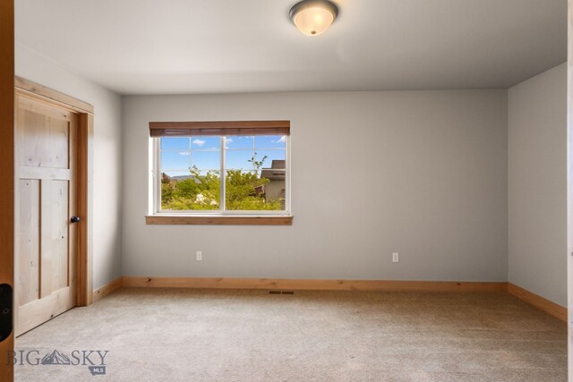 1025 Advance Dr, Bozeman, MT 59718 - spare room with light carpet and baseboards