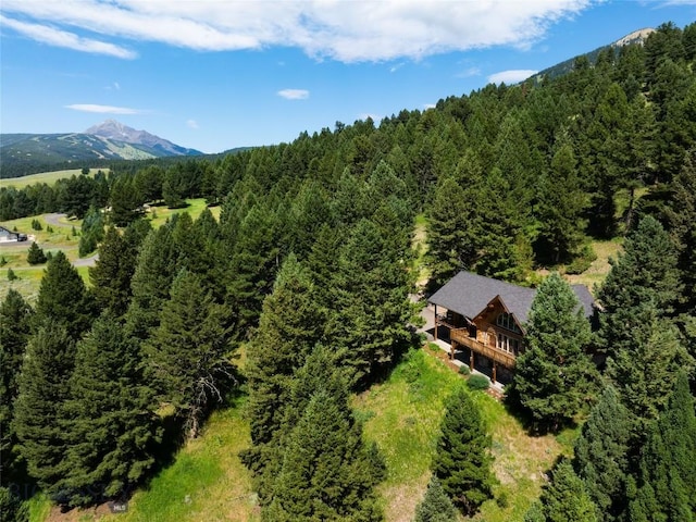 2415 Crazy Horse Rd, Big Sky, MT 59716 - aerial view of property and surrounding area featuring a heavily wooded area and mountains