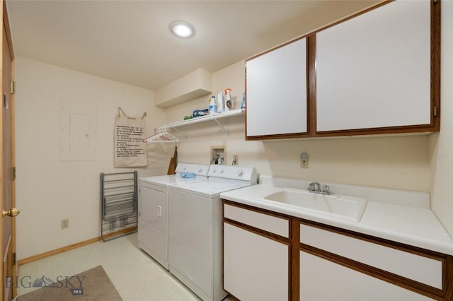 2415 Crazy Horse Rd, Big Sky, MT 59716 - washroom featuring washing machine and dryer, cabinet space, and baseboards