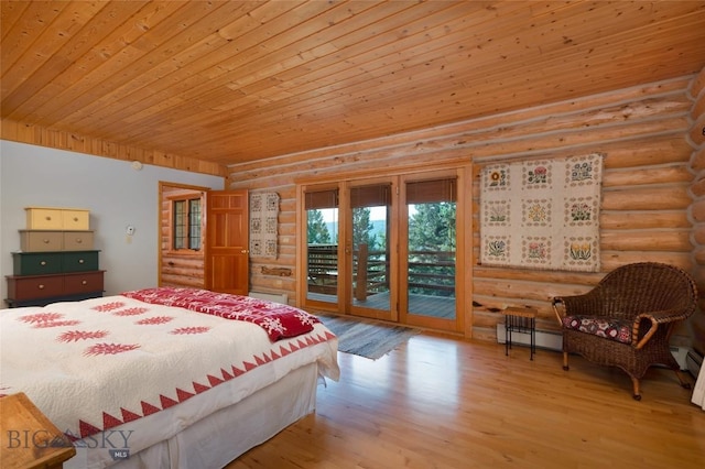 2415 Crazy Horse Rd, Big Sky, MT 59716 - bedroom with rustic walls, access to exterior, wood finished floors, a baseboard heating unit, and wooden ceiling