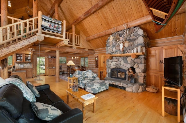 2415 Crazy Horse Rd, Big Sky, MT 59716 - living room with rustic walls, high vaulted ceiling, wood ceiling with exposed beams, a fireplace, and hardwood / wood-style flooring