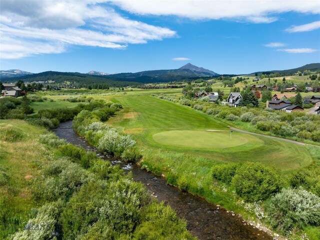 2415 Crazy Horse Rd, Big Sky, MT 59716 - view of property's community with a mountain view, view of golf course, and a putting area