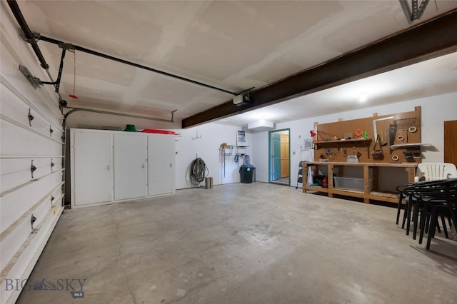 2415 Crazy Horse Rd, Big Sky, MT 59716 - garage with a garage door opener and a workshop area