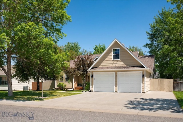 56 Green Belt Dr, Belgrade, MT 59714 - view of front of home featuring a garage, central AC, and concrete driveway