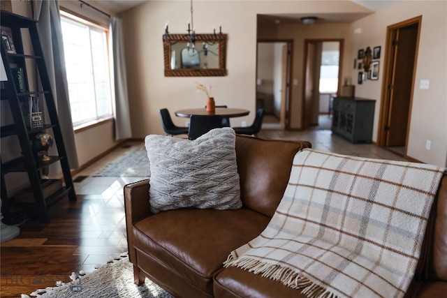 56 Green Belt Dr, Belgrade, MT 59714 - living area featuring baseboards and wood finished floors