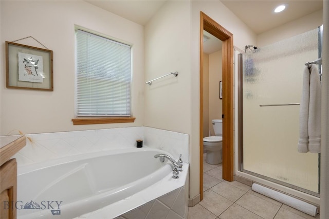 56 Green Belt Dr, Belgrade, MT 59714 - bathroom featuring toilet, tile patterned flooring, a bath, and a shower stall