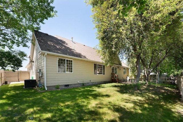 56 Green Belt Dr, Belgrade, MT 59714 - back of house with central air condition unit and a shingled roof