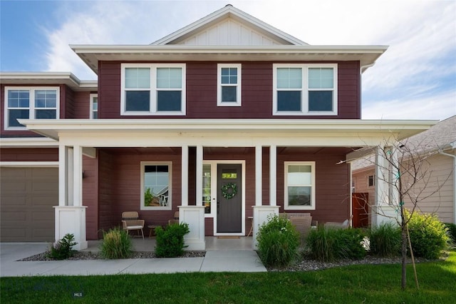 810 Butler Crk, Belgrade, MT 59714 - view of front of house featuring a porch, an attached garage, and board and batten siding