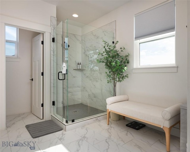 810 Butler Crk, Belgrade, MT 59714 - bathroom with marble look tiles, a marble finish shower, and recessed lighting