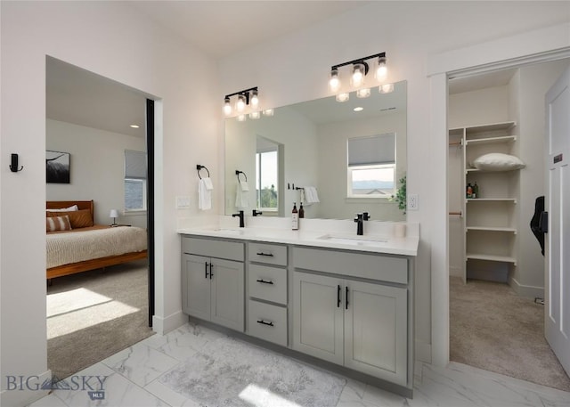 810 Butler Crk, Belgrade, MT 59714 - ensuite bathroom featuring marble finish floors and double vanity