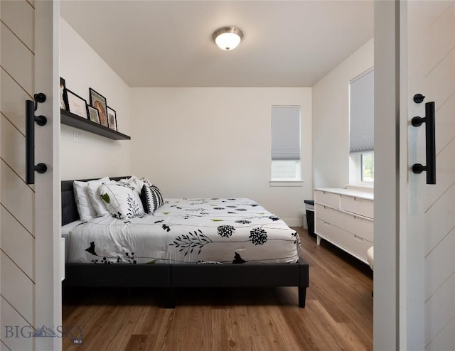 810 Butler Crk, Belgrade, MT 59714 - bedroom featuring wood finished floors