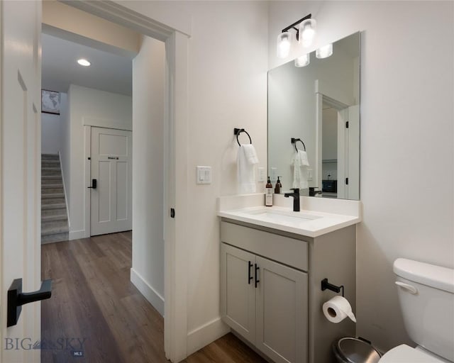 810 Butler Crk, Belgrade, MT 59714 - bathroom featuring vanity, wood finished floors, and recessed lighting