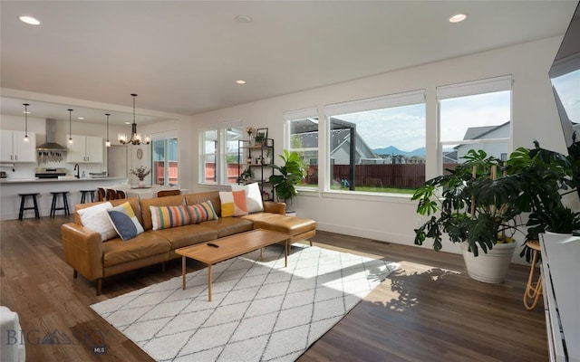 810 Butler Crk, Belgrade, MT 59714 - living room featuring wood finished floors, a chandelier, and recessed lighting