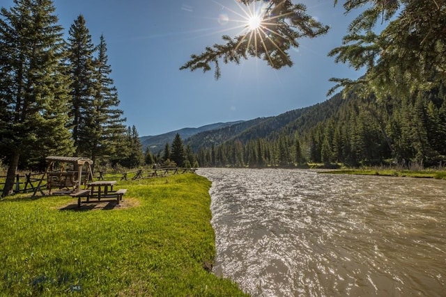48042 Gallatin Rd, Big Sky, MT 59730 - view of property's community featuring a mountain view and a view of trees