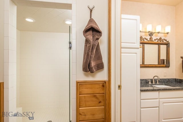 48042 Gallatin Rd, Big Sky, MT 59730 - bathroom featuring vanity, tiled shower, and recessed lighting