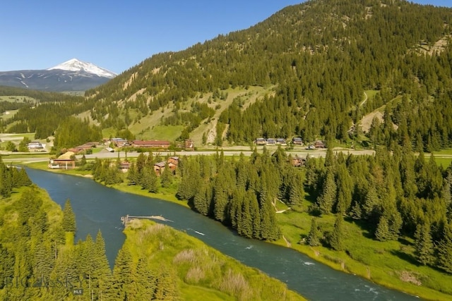 48042 Gallatin Rd, Big Sky, MT 59730 - mountain view with a forest and a nearby body of water
